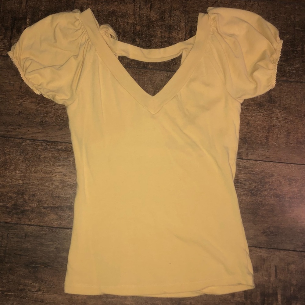 Yellow V cut shirt.
